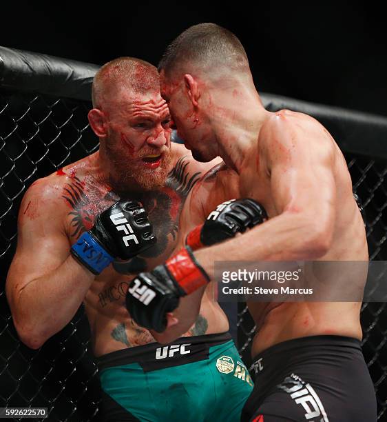 Conor McGregor and Nate Diaz battle during their welterweight rematch at the UFC 202 event at T-Mobile Arena on August 20, 2016 in Las Vegas, Nevada....