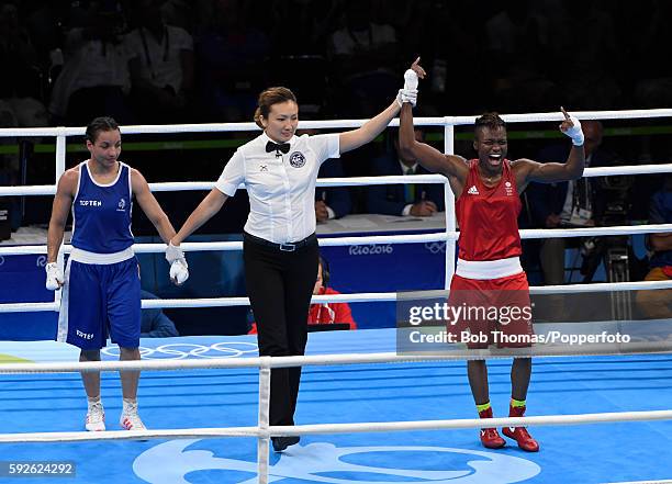 Nicola Adams of Great Britain is declared the winner after the Women's Fly Final Bout against Sarah Ourahmoune of France on Day 15 of the Rio 2016...