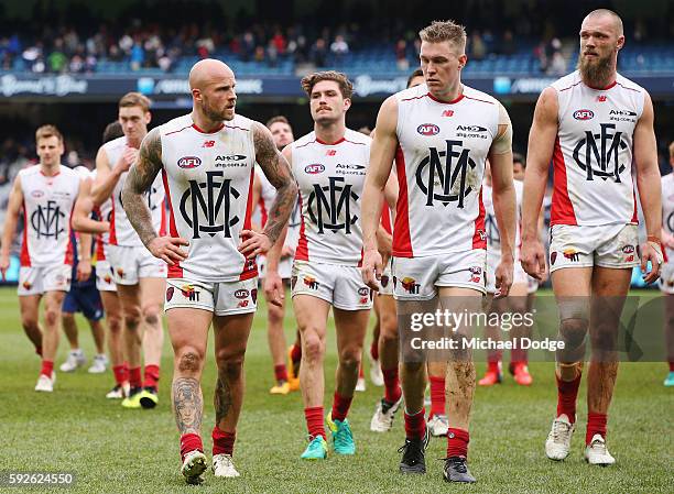 Nathan Jones of the Demons leads the team off after defeat during the round 22 AFL match between the Carlton Blues and the Melbourne Demons at...