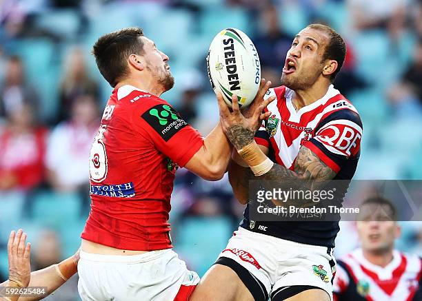 Gareth Widdop of the Dragons competes with Blake Ferguson of the Roosters for a high ball during the round 24 NRL match between the Sydney Roosters...