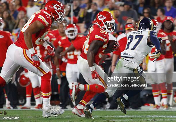 Knile Davis of the Kansas City Chiefs runs the ball down field during a preseason game against the Los Angeles Rams at the Los Angeles Memorial...