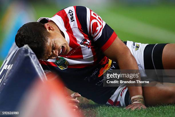 Latrell Mitchell of the Roosters shows signs of discomfort during the round 24 NRL match between the Sydney Roosters and the St George Illawarra...