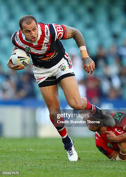 Blake Ferguson of the Roosters runs the ball during the round 24 NRL match between the Sydney Roosters and the St George Illawarra Dragons at Allianz...