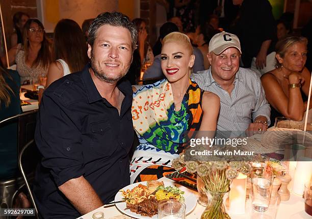 Blake Shelton, Gwen Stefani and Ronald O. Perelman attend Apollo in the Hamptons 2016 at The Creeks on August 20, 2016 in East Hampton, New York.