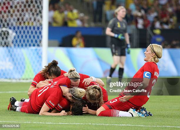 Saskia Bartusiak of Germany celebrates the first goal of Dzsenifer Marozsan with teammates during the Women's Soccer Final between Germany and Sweden...