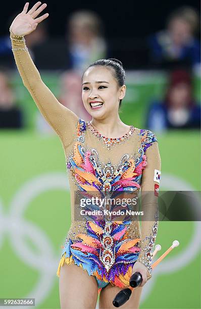 Son Yeon Jae of South Korea waves to the crowd after her performance during the rhythmic gymnastics individual all-around final at the Summer...