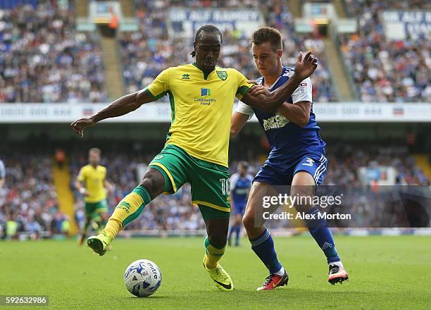 Cameron Jerome of Norwich City is closed down by Jonas Knudsen of Ipswich Town during the Sky Bet Championship match between Ipswich Town and Norwich...