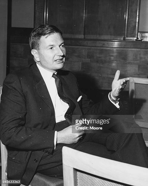 Banker David Rockefeller, Chairman of the Chase Manhattan Corporation, pictured in conversation at the Savoy Hotel during the Chase Investment Forum,...