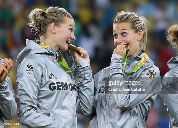 Gold medalists Alexandra Popp and Lena Goessling of Germany pose during the medal ceremony for the Women's Soccer Final between Germany and Sweden at...