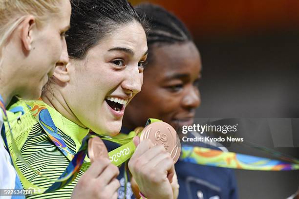 Brazil's Mayra Aguiar smiles with her bronze medal for the women's 78-kg judo competition at the Summer Olympics in Rio de Janeiro on Aug. 11, 2016.