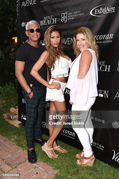 Sean Edison, Paula Pando and Monique Wisniewski attend the AVENUE on the Beach Celebrates Of Rare Origin and our August Issue at the Baker House on...