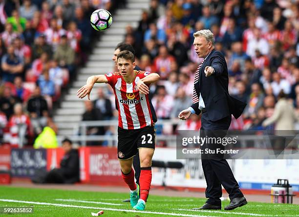 David Moyes, Manager of Sunderland gives instructions as Donald Love of Sunderland takes a throw in during the Premier League match between...