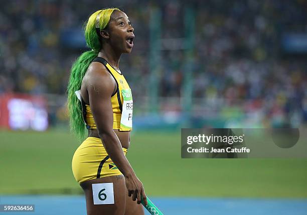 Shelly-Ann Fraser-Pryce of Jamaica celebrates winning the silver medal in the Women's 4 x 100m Relay on day 14 of the Rio 2016 Olympic Games at...