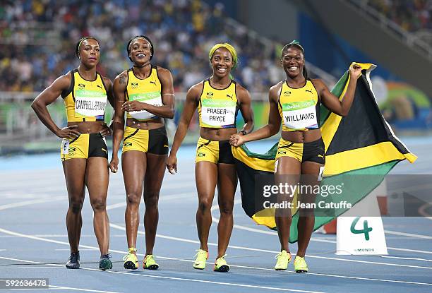 Veronica Campbell-Brown, Elaine Thompson, Shelly-Ann Fraser-Pryce and Christania Williams of Jamaica celebrate winning the silver medal in the...