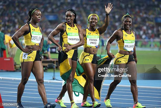 Veronica Campbell-Brown, Elaine Thompson, Shelly-Ann Fraser-Pryce and Christania Williams of Jamaica celebrate winning the silver medal in the...