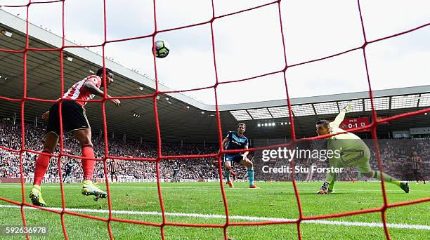 Middlesbrough player Christian Stuani scores the second goal despite the efforts of Sunderland defender Patrick van Aanholt on the line during the...
