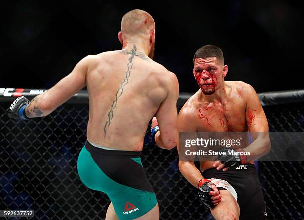 Conor McGregor and Nate Diaz battle during their welterweight rematch at the UFC 202 event at T-Mobile Arena on August 20, 2016 in Las Vegas, Nevada....