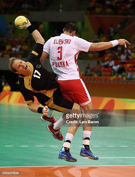 Steffen Weinhold of Germany takes a shot under pressure of Krzysztof Lijewski of Poland during the Men's Bronze Medal Match between Poland and...
