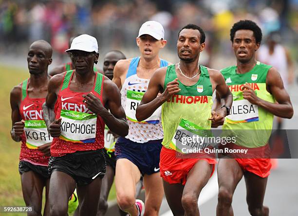 Eliud Kipchoge of Kenya, Galen Rupp of the United States, Lemi Berhanu of Ethiopia and Feyisa Lilesa of Ethiopia compete during the Men's Marathon on...