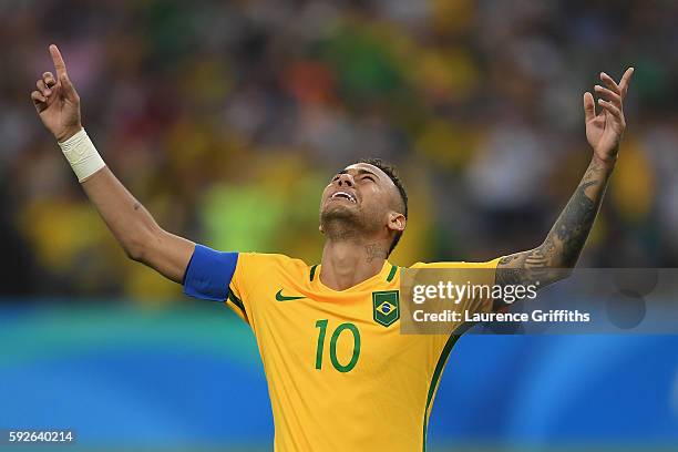 Neymar of Brazil celebrates scoring the winning penalty in the penalty shoot out during the Men's Football Final between Brazil and Germany at the...