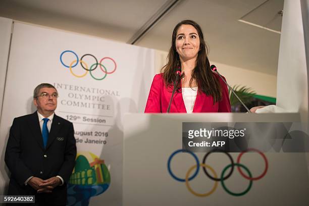 Newly elected member of the IOC Athletes Commission Sarah Walker, of New Zealand, takes oath during the election of new IOC members in the IOC 129th...