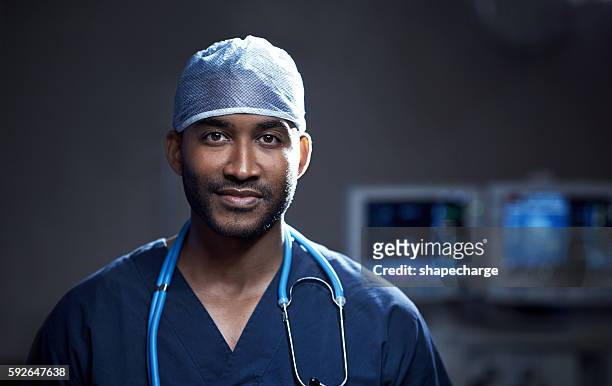 skilled in saving lives - doctor portrait stockfoto's en -beelden