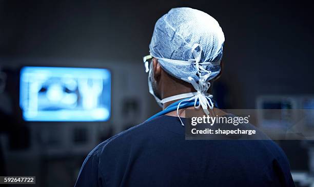 彼の手術室の指揮で - operating room ストックフォトと画像