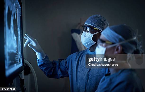 surgical excellence at it’s best - doctor technology stock pictures, royalty-free photos & images