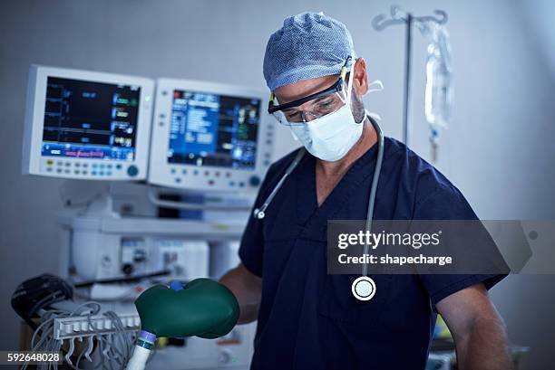 anesthesiologists are vital members of any surgical team - anesthesiologist stock pictures, royalty-free photos & images