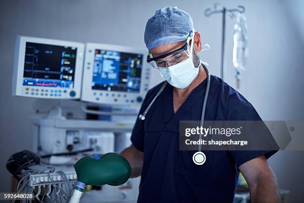 anesthesiologists are vital members of any surgical team - anaesthetist stock pictures, royalty-free photos & images