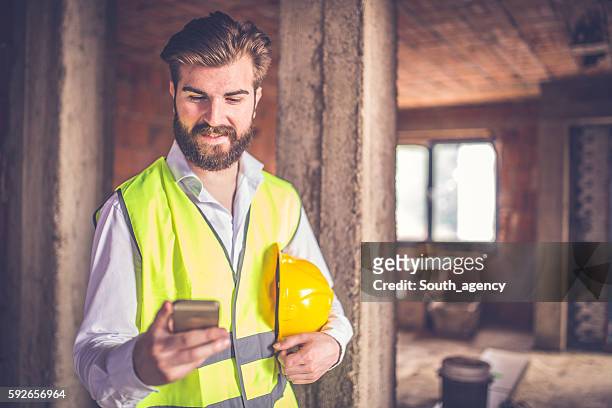 engineer using smart phone - brick phone stock pictures, royalty-free photos & images