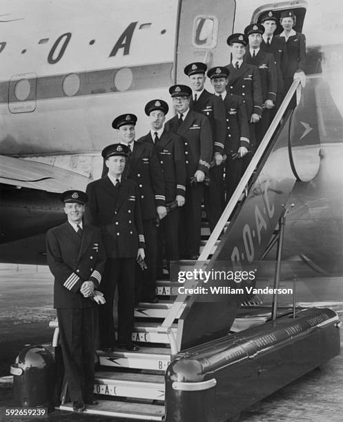 Portrait of the crew of the BAOC Stratocruiser airplane which will take Queen Elizabeth II on her tour of the Commonwealth; Captain Anthony Loraine,...