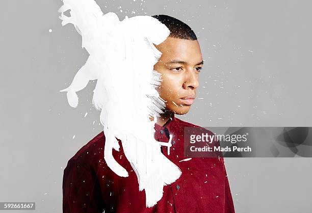 ink splatter on face - white shirt stain stock pictures, royalty-free photos & images