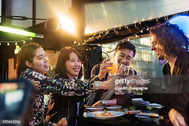 friends in a pub in japan - only japanese stock pictures, royalty-free photos & images