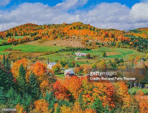 peak autumn sugar maples with village in vermont - green mountain range stock pictures, royalty-free photos & images