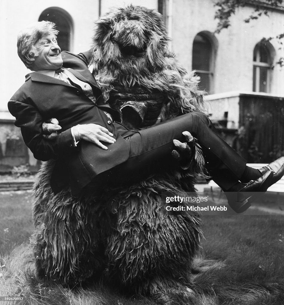Pertwee Portrait of 'Dr Who' actor Jon Pertwee being carried by one of the ...