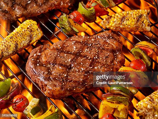 bbq rib eye steaks with corn and veggie kabobs - strip steak stock pictures, royalty-free photos & images