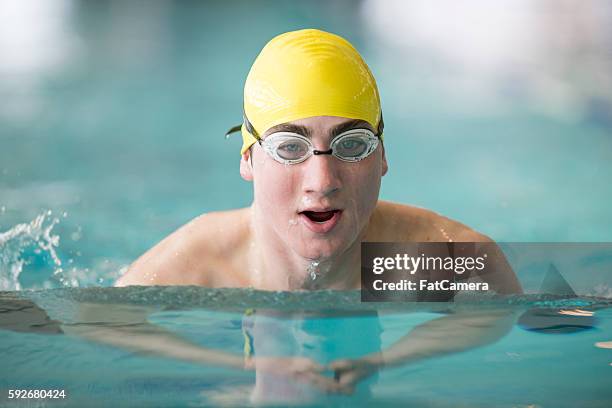lane swimming at the pool - boy swimming pool goggle and cap stock pictures, royalty-free photos & images