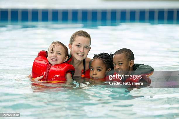 taking swimming lessons - lifeguard stock pictures, royalty-free photos & images