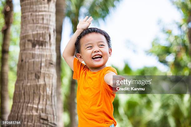 happy little boy practicing martial arts outdoors - kung fu pose stock pictures, royalty-free photos & images
