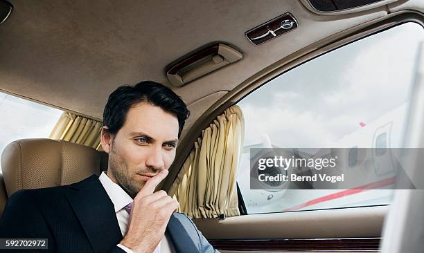 businessman in limousine - rich celebrities stock pictures, royalty-free photos & images