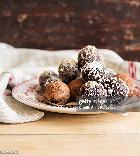 assorted dark chocolate truffles with cocoa powder - chocolate truffle bildbanksfoton och bilder