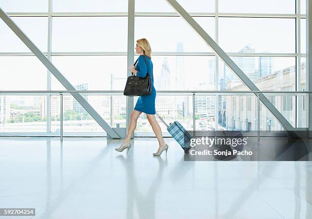 businesswoman walking in moderne space - moderne stock pictures, royalty-free photos & images