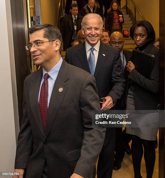 Congressman Xavier Becerra, , left, and Vice President Joe Biden, arrives for a House Democratic Caucus meeting for an unusual New Year's Day session...