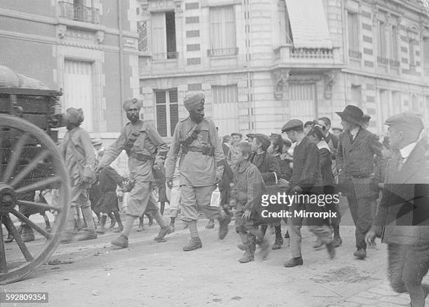 School children seen here following the soldiers of the 3rd Lahore Indian Division through the streets of Orleans. September 24th 1914