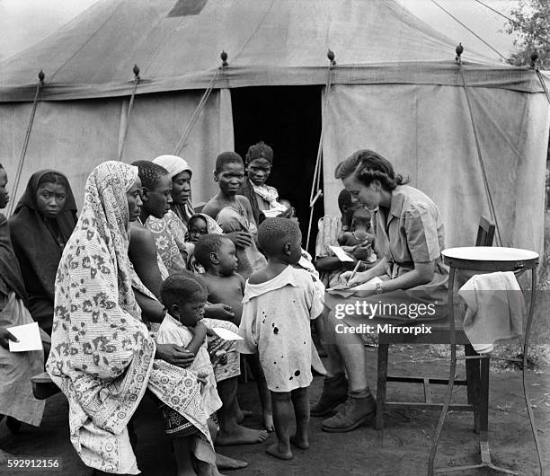 East African groundnuts scheme. Open air hospital at Kongwa - Sister Helen Porter with native mothers and babies. May 1952 O15017-003