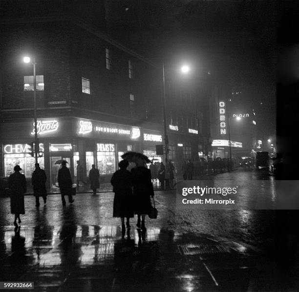 Fog in Manchester turns day into night here is the scene at 1.30pm in Oxford Street, Manchester, Greater Manchester. 17th November 1953