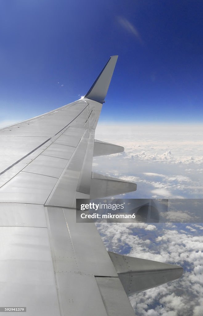 View of the wing through an airplane window