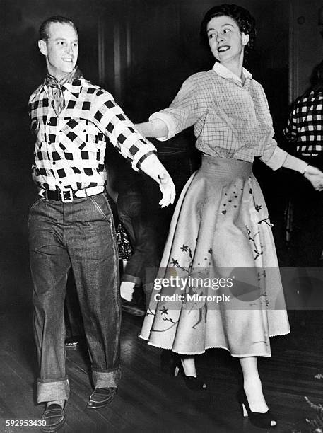 Queen Elizabeth II, Princess Elizabeth and the Duke of Edinburgh square dancing at a cowboy dress party during the royal tour of Canada