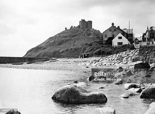 Criccieth Castle, situated on the headland between two beaches in Criccieth, Gwynedd, in North Wales, on a rocky peninsula overlooking Tremadog Bay....